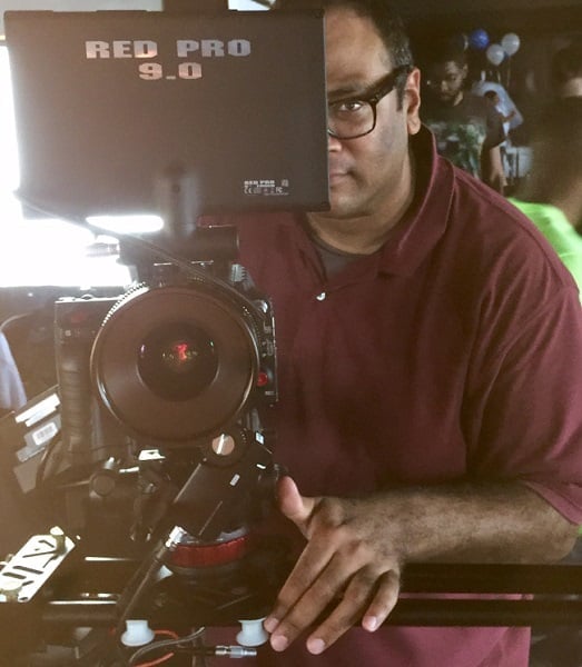 Film Connection grad Ananth Agastya filming with camera on set