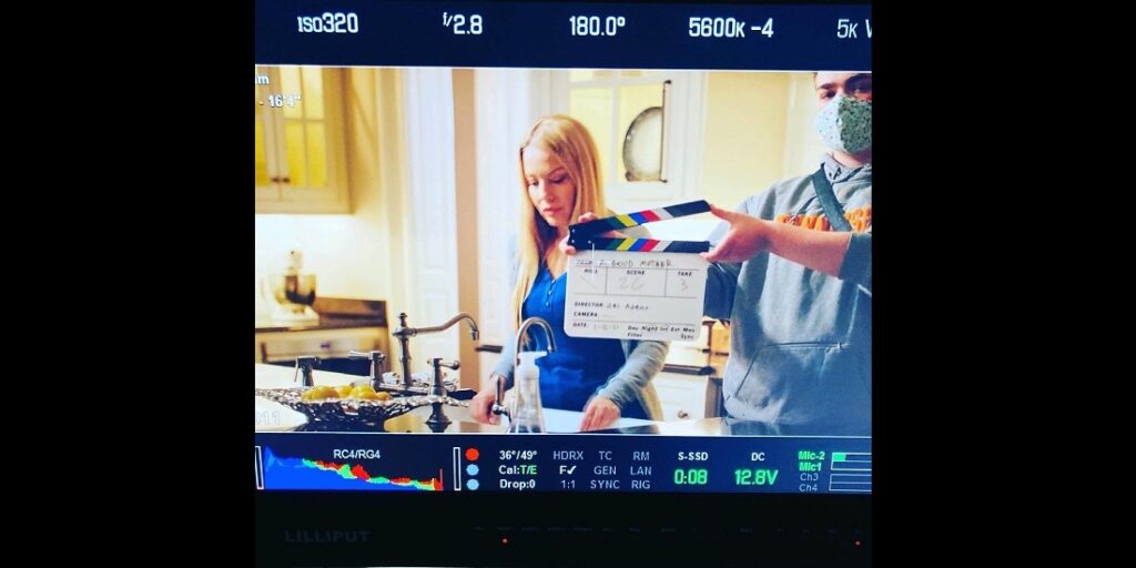 Behind the scenes shot of Film Connection grad Carter Rutledge on the set of "A Good Mother"