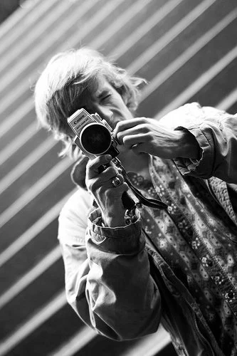 Film Connection student Stephen Blanquie using a Canon camera on set