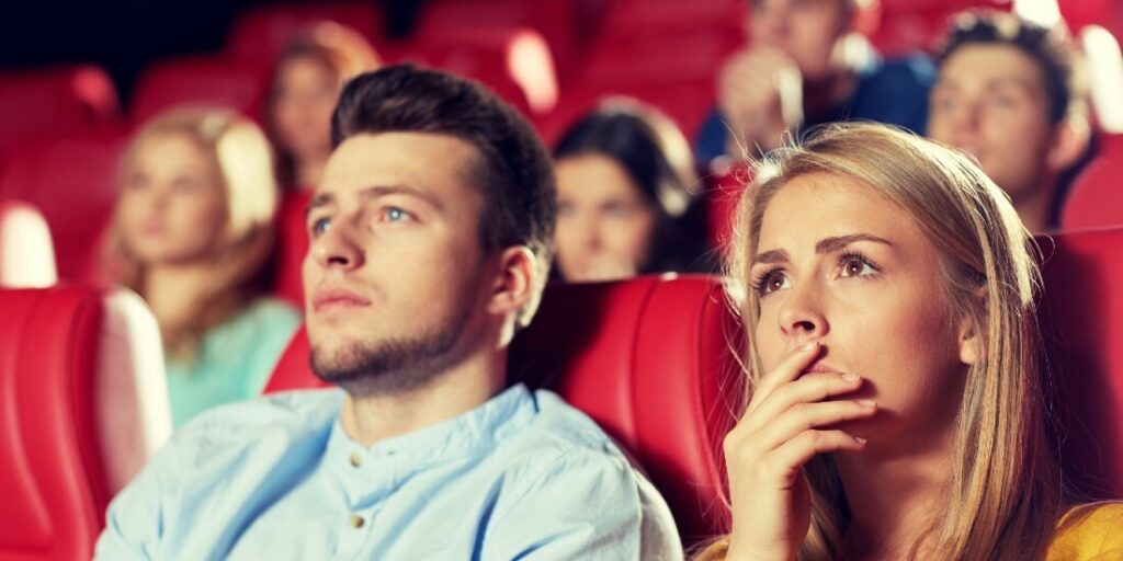 a couple watching a film and