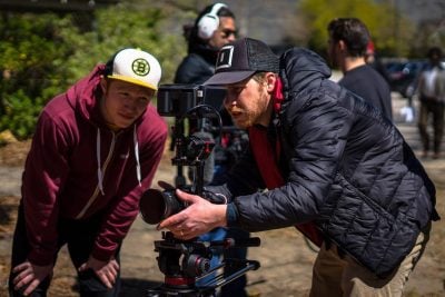 Film Connection student Nate Crockett & mentor Geno DiMaria framing shot for “Hindsight.”