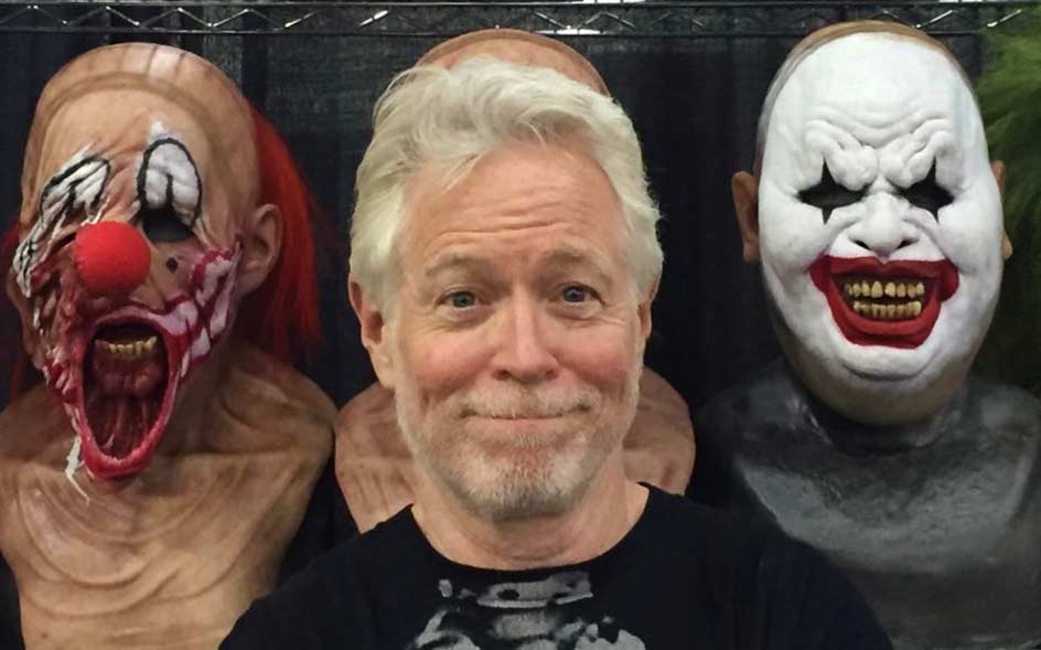 Film Connection mentor Ron Osborn standing in front of clown masks on a movie set